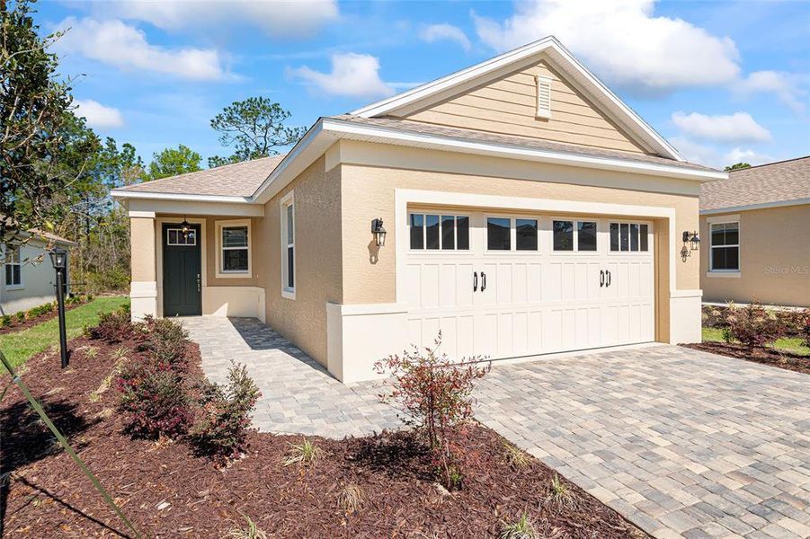 Front exterior of a new home in , Ocala, FL, highlighting curb appeal (Image 22).