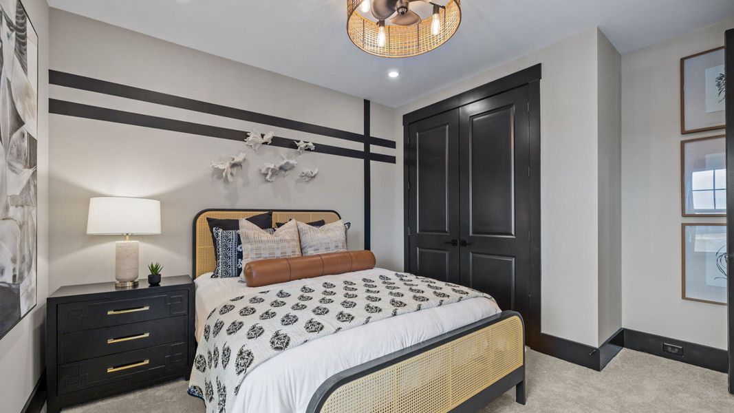 The Enthusiast Plan by DBR Homes with a secondary bedroom in Fort Mill, SC