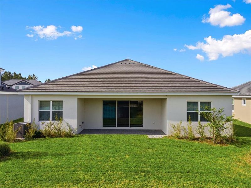 Exterior details and patio area of a home in Tamarack at Two Rivers, Zephyrhills (Image 35).