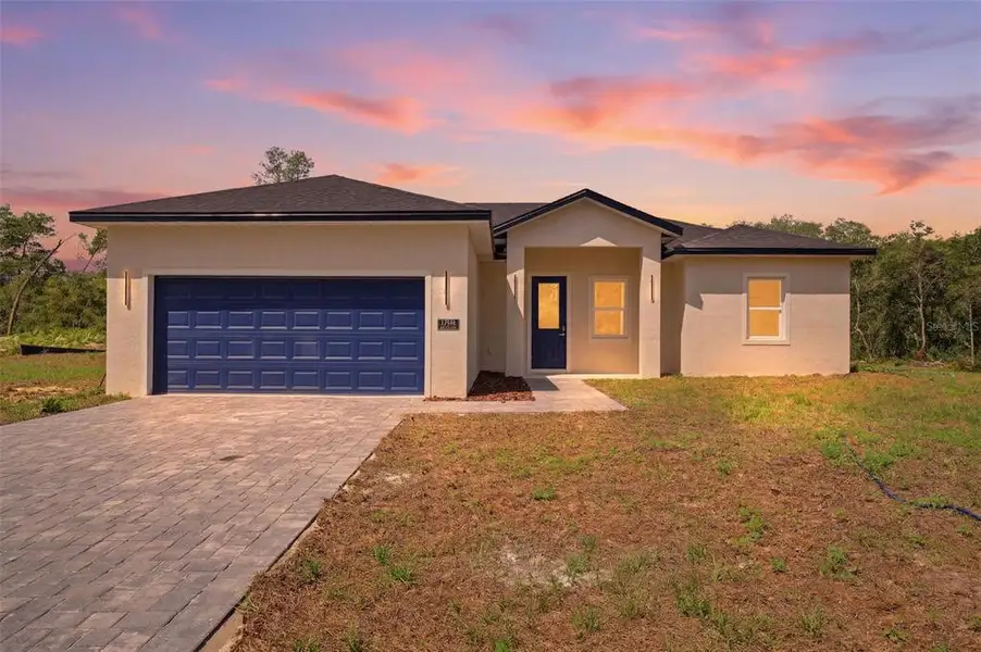 Front exterior of a new home in , Ocala, FL, highlighting curb appeal (Image 1). Front exterior of a new home in , Ocala, FL, highlighting curb appeal (Image 1).