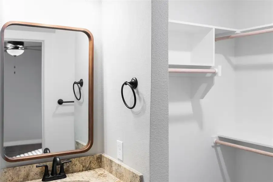 Bathroom featuring a sink and ceiling fan