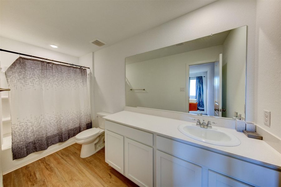 Primary bathroom with shower and tub