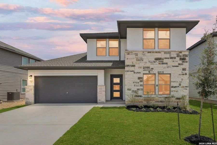 Front exterior of a new home in Summerlin, San Antonio, TX, highlighting curb appeal (Image 1). Front exterior of a new home in Summerlin, San Antonio, TX, highlighting curb appeal (Image 1).