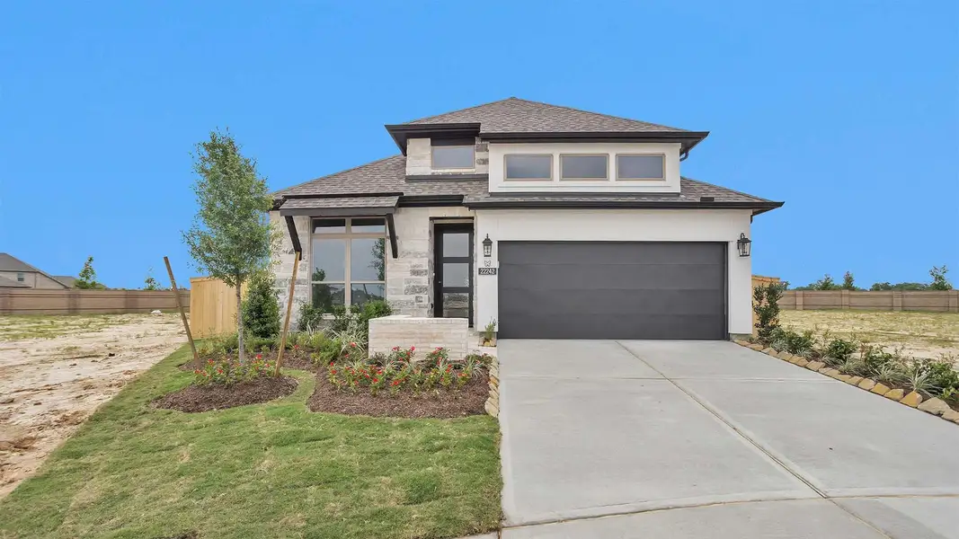 Front exterior of a new home in Bridgeland, Cypress, TX, highlighting curb appeal (Image 2).