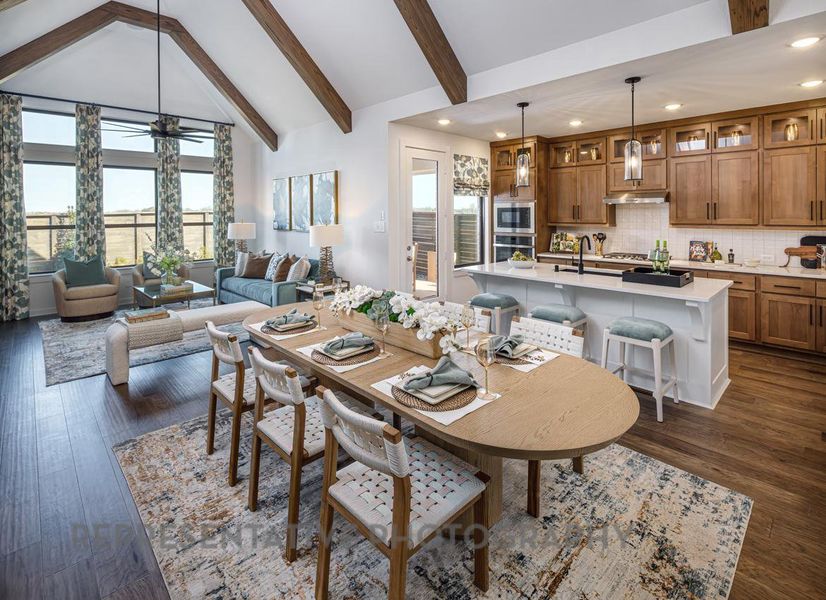 Dining room featuring plenty of natural light, recessed lighting, beamed ceiling, dark wood finished floors, and a ceiling fan