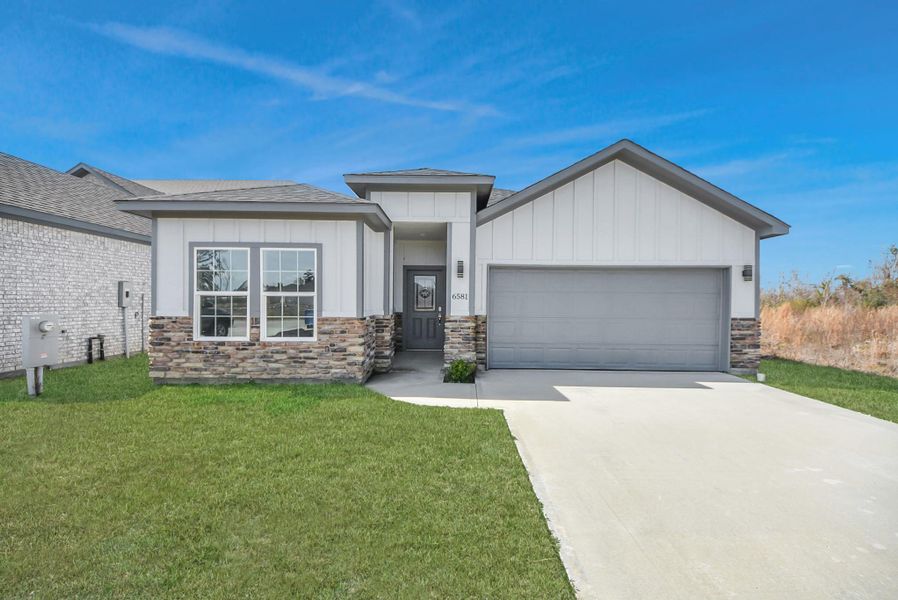 Front exterior of a new home in , Cleveland, TX, highlighting curb appeal (Image 25).