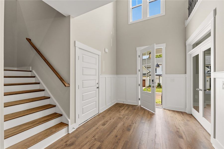 A spacious foyer welcomes you with high ceilings,