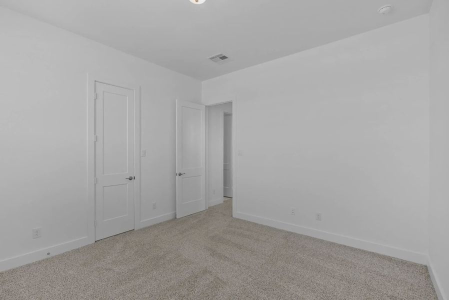 Representative unfurnished interior of a home built from the Nicklaus by Chesmar Homes in Riceland Alley Loads, Mont Belvieu (Image 71).