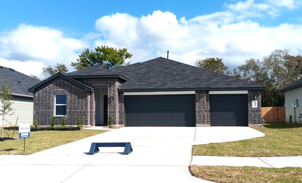 Front exterior of a new home in Medina, Dayton, TX, highlighting curb appeal (Image 1).