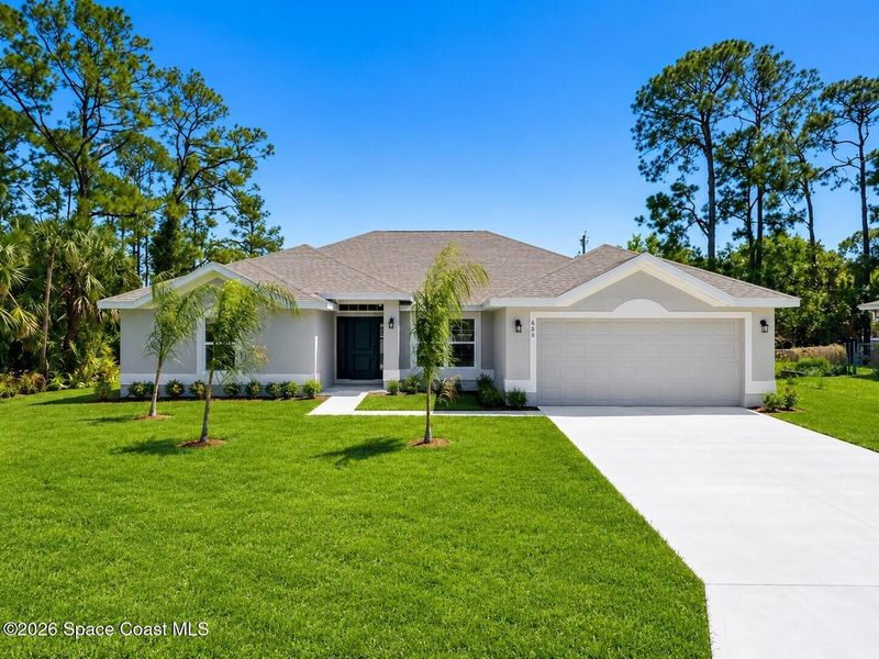 Front exterior of a new home in Palm Bay, Palm Bay, FL, highlighting curb appeal (Image 1). Front exterior of a new home in Palm Bay, Palm Bay, FL, highlighting curb appeal (Image 1).