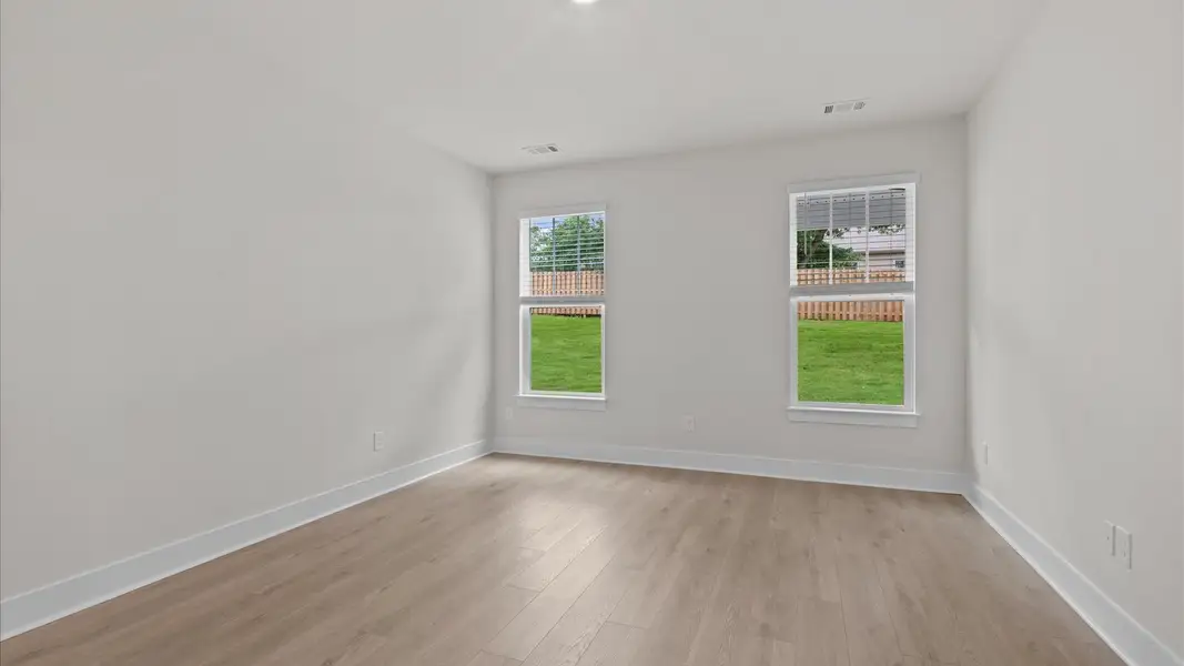 Hardwood flooring primary suite in two story townhome at Aspen Ridge by DRB Homes in Lyman, SC Hardwood flooring primary suite in two story townhome at Aspen Ridge by DRB Homes in Lyman, SC