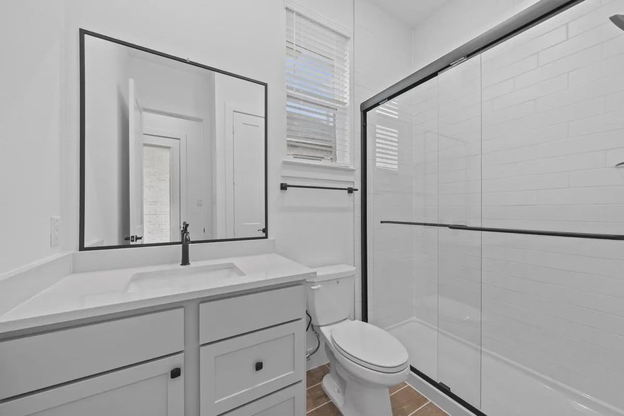 Representative furnished interior of a home built from the Summerton by Chesmar Homes in University Heights, Round Rock (Image 12).