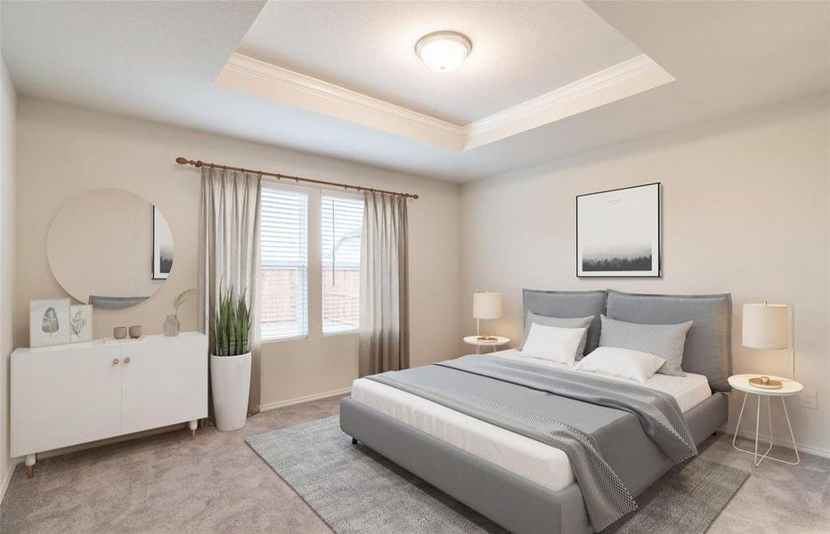 Bedroom with a tray ceiling, light colored carpet, and crown molding Bedroom with a tray ceiling, light colored carpet, and crown molding