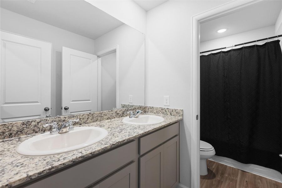 Furnished interior view inside a new home in Lakes at Black Oak, Magnolia (Image 9).