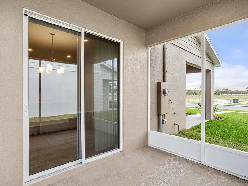 The Aria includes a covered lanai in select communities - Aria bungalow by Highland Homes