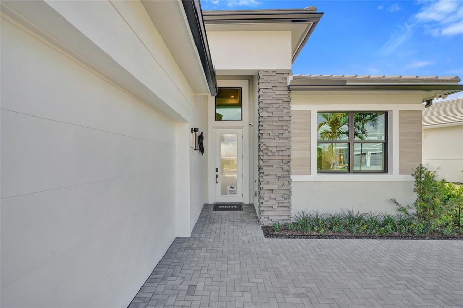 Exterior details and patio area of a home in Esprit at Avenir, Palm Beach Gardens (Image 22).