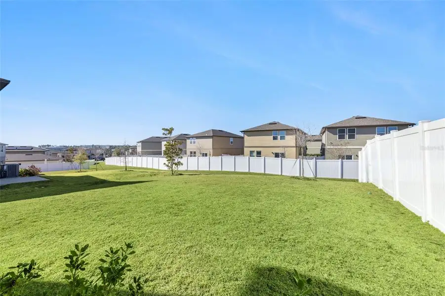 Exterior details and patio area of a home in Hills of Minneola, Minneola (Image 3).