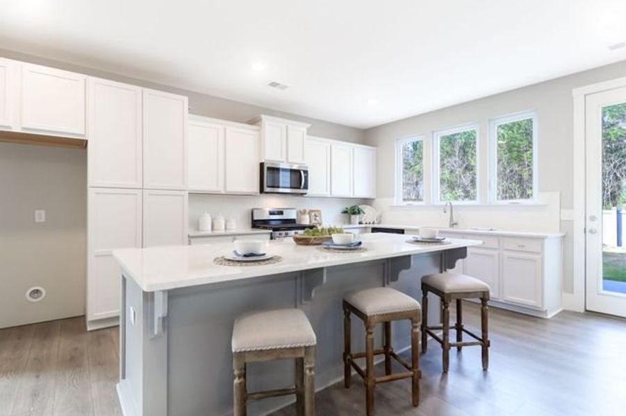 Representative furnished interior of a home built from the Inverness P by True Homes in Homecoming, Ravenel (Image 2).