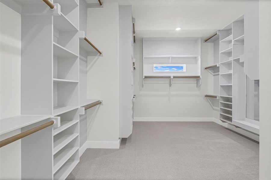 Walk in closet with light colored carpet Walk in closet with light colored carpet