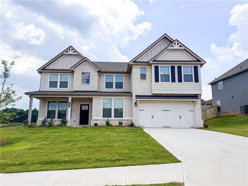 Front exterior of a new home in , Stockbridge, GA, highlighting curb appeal (Image 36).