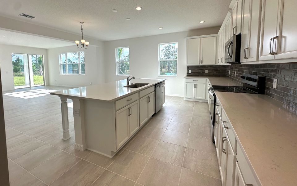Furnished interior view inside a new home in Trinity Gardens, Deland (Image 4).