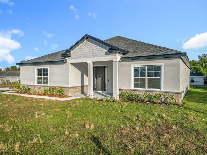 Front exterior of a new home in , Ocala, FL, highlighting curb appeal (Image 21). Front exterior of a new home in , Ocala, FL, highlighting curb appeal (Image 21).