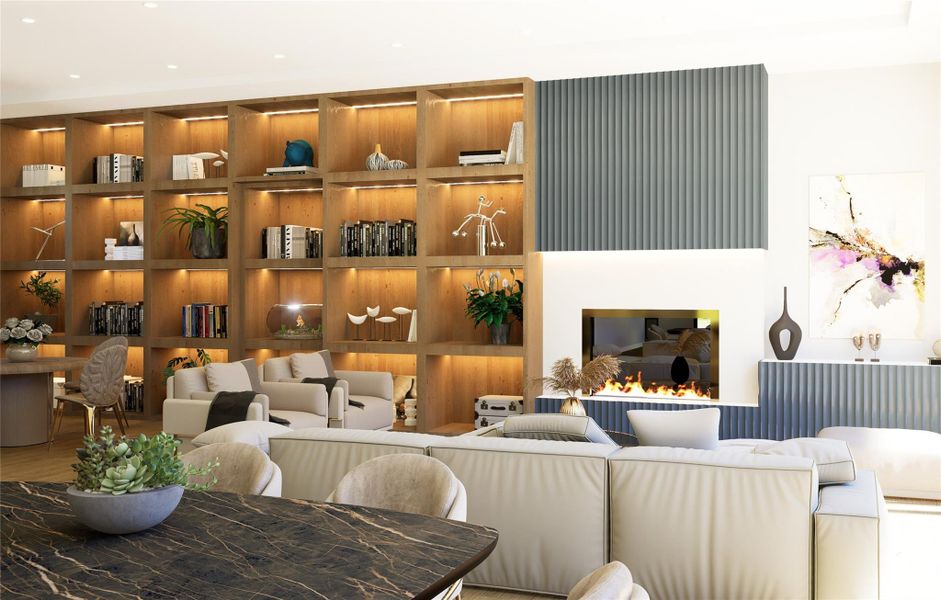 Elegant living area with custom built-ins, modern fireplace, and designer lighting.