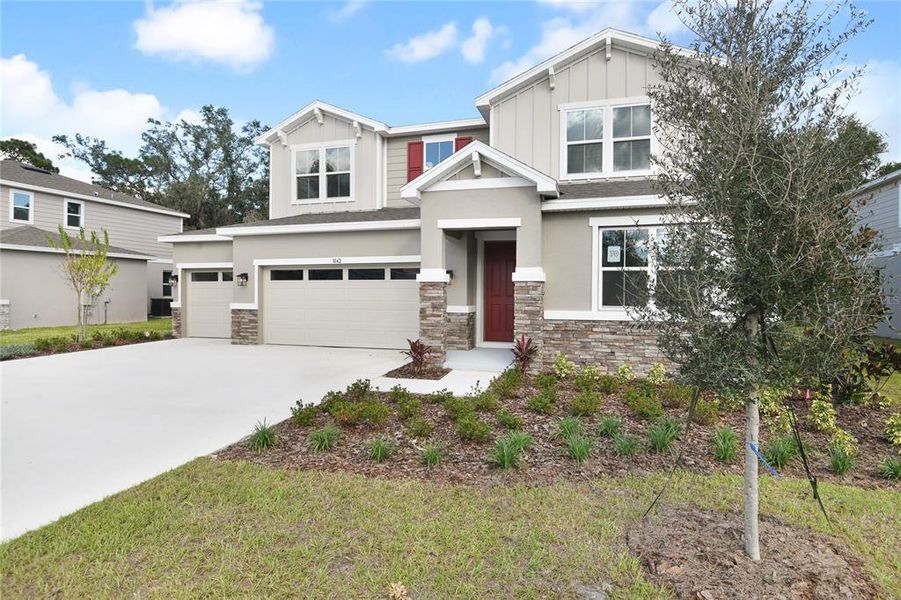 Front exterior of a new home in Seasons at Wekiva Ridge, Mount Dora, FL, highlighting curb appeal (Image 2). Front exterior of a new home in Seasons at Wekiva Ridge, Mount Dora, FL, highlighting curb appeal (Image 2).