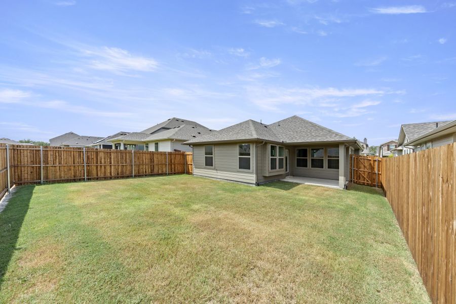 Exterior details and patio area of a home in Keeneland, Aubrey (Image 20).