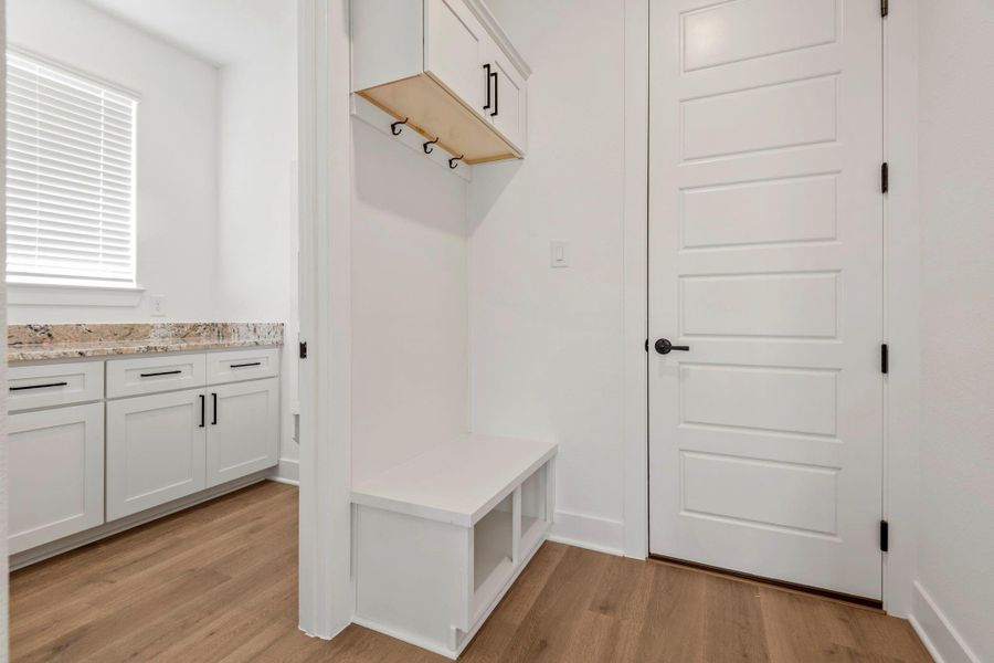 The mudroom features a catch all station.