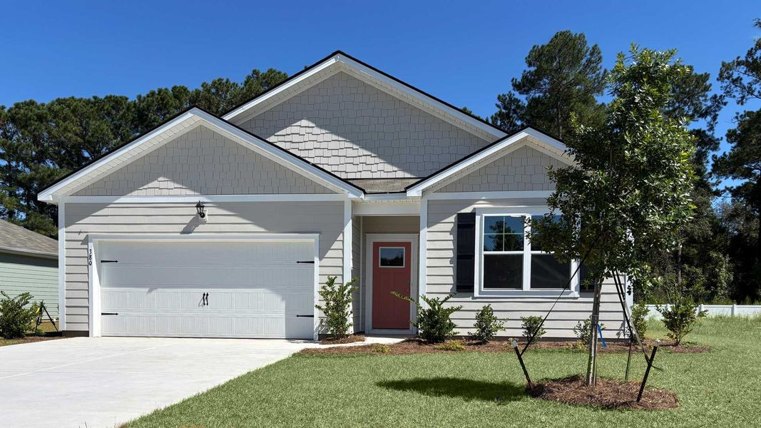 Front exterior of a new home in Ravenloft, Conway, SC, highlighting curb appeal (Image 1).