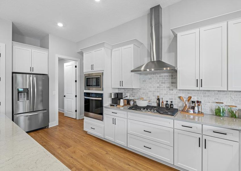 Stainless steel kitchen appliances are included.