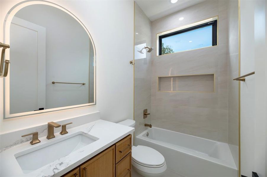 Full bathroom featuring shower combination and vanity Full bathroom featuring shower combination and vanity
