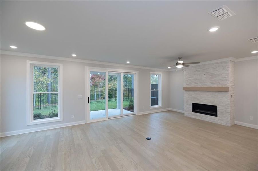 There are tons of windows that open up to a wooded backyard. *Please note photos shown are of the Ellington plan but not of the actual home.