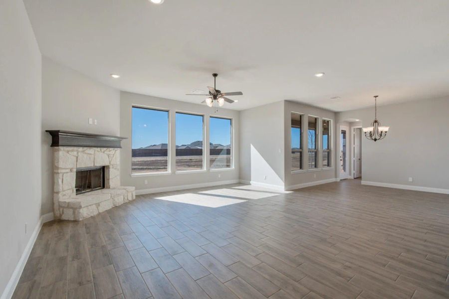 Family Room & Nook | Concept 2586 at Hidden Creek Estates in Van Alstyne, TX by Landsea Homes