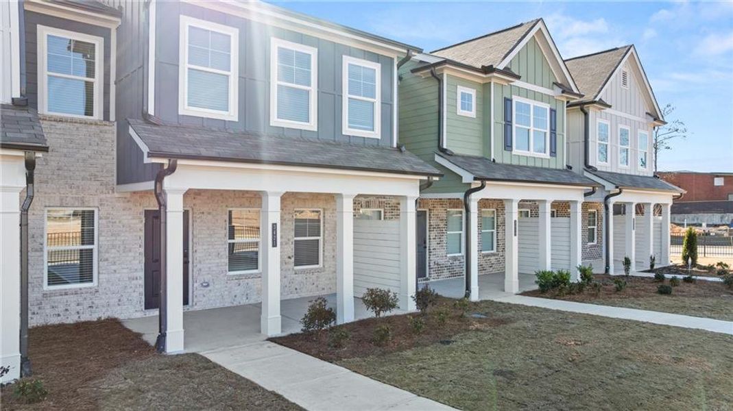 Front exterior of a new home in Lake Carlton, Loganville, GA, highlighting curb appeal (Image 18).