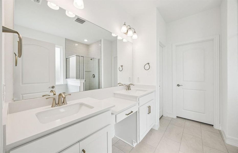 Luxurious owner's bath complete with double sinks and a generous shower *Real home pictured Luxurious owner's bath complete with double sinks and a generous shower *Real home pictured