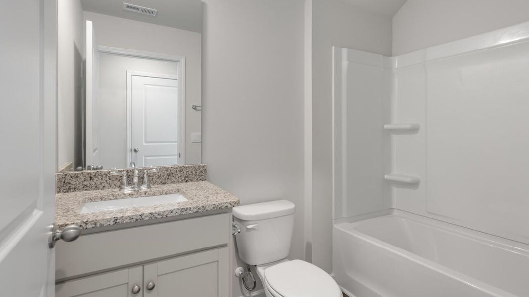 Furnished interior view inside a new home in Indigo Preserve, Leland (Image 13).