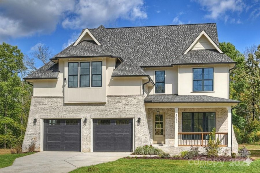 Front exterior of a new home in , Charlotte, NC, highlighting curb appeal (Image 1).