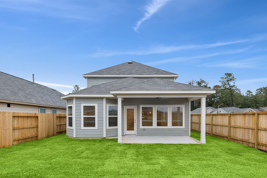 Exterior details and patio area of a home in Pinewood at Grand Texas, New Caney (Image 10).