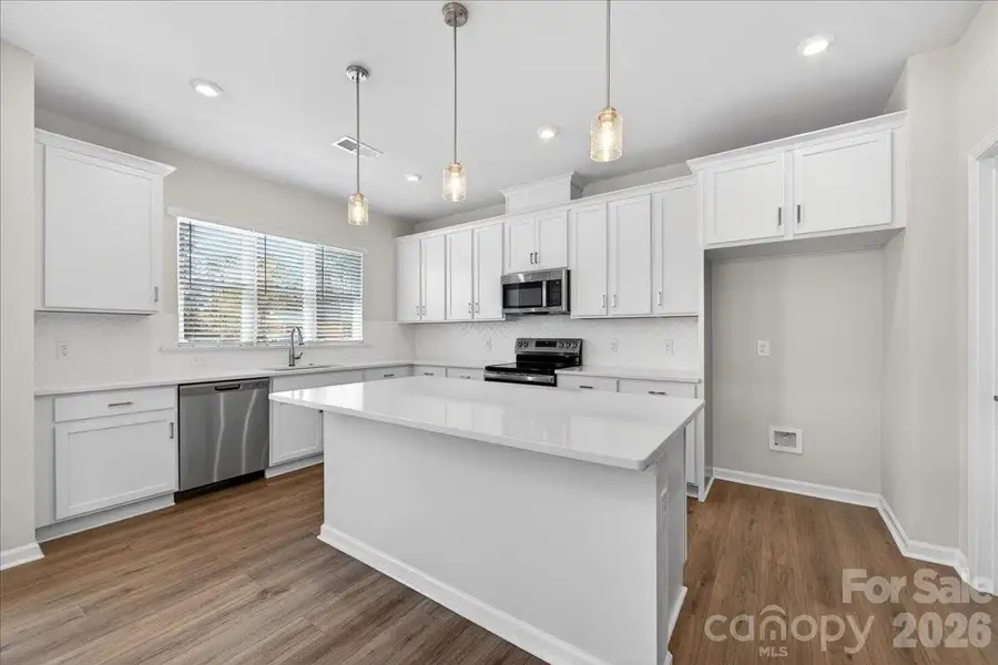 Chef inspired kitchen with large windows
