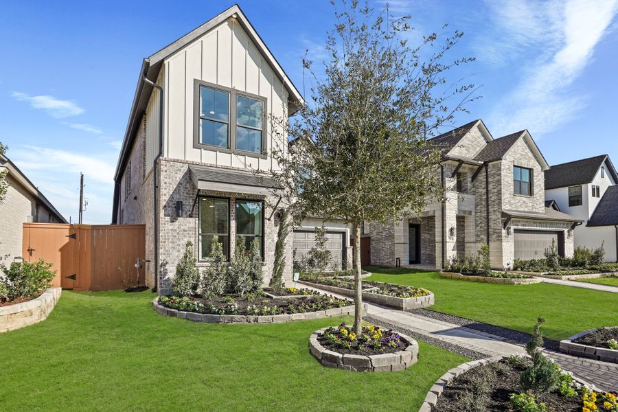 Front exterior of a new home in Elyson 45' & 70', Katy, TX, highlighting curb appeal (Image 27).