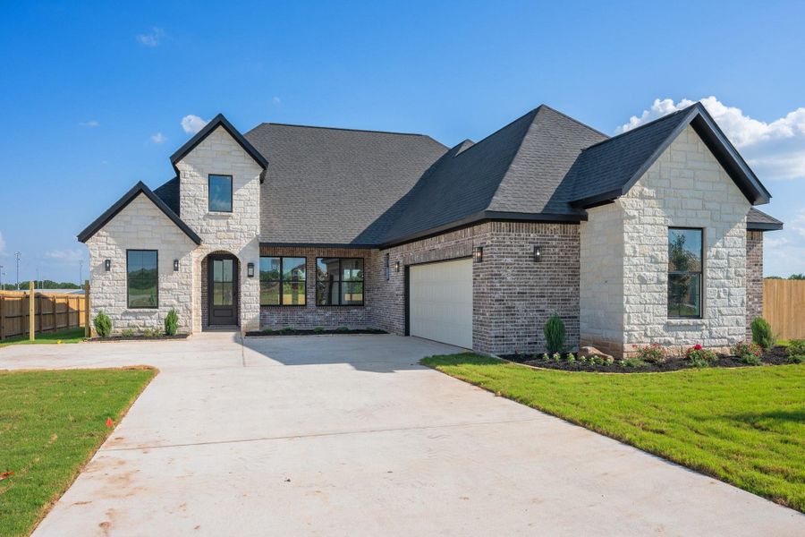 Front exterior of a new home in , College Station, TX, highlighting curb appeal (Image 2).