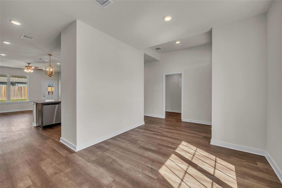 Spare room with recessed lighting, ceiling fan, and wood finished floors Spare room with recessed lighting, ceiling fan, and wood finished floors