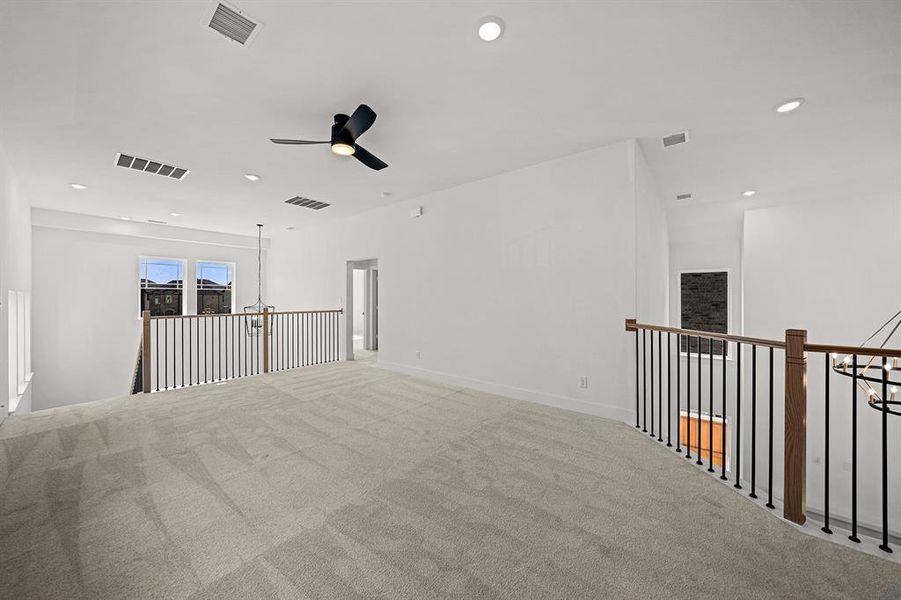 Carpeted empty room featuring recessed lighting and a ceiling fan