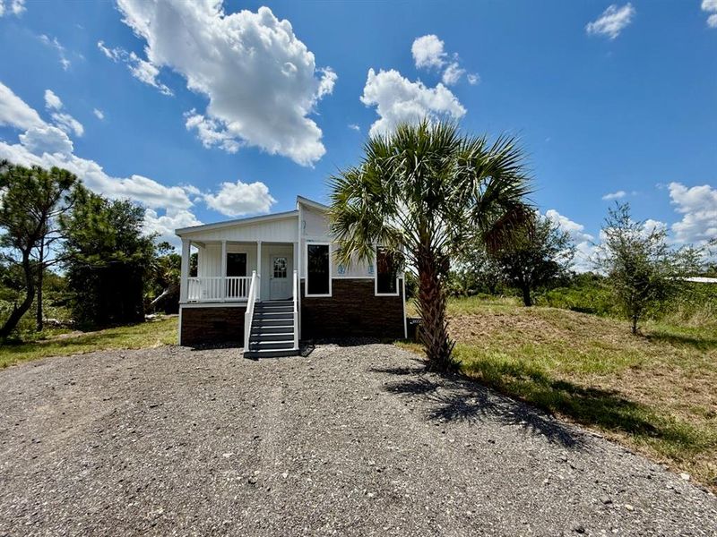 Front exterior of a new home in , Punta Gorda, FL, highlighting curb appeal (Image 30). Front exterior of a new home in , Punta Gorda, FL, highlighting curb appeal (Image 30).