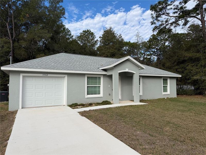 Front exterior of a new home in , Dunnellon, FL, highlighting curb appeal (Image 1). Front exterior of a new home in , Dunnellon, FL, highlighting curb appeal (Image 1).