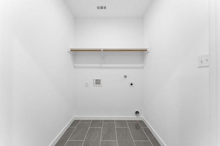 Laundry room featuring hookup for an electric dryer and hookup for a washing machine Laundry room featuring hookup for an electric dryer and hookup for a washing machine