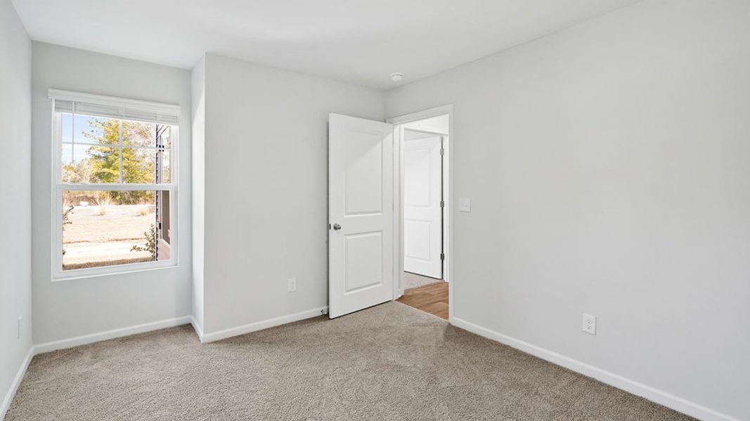 Representative unfurnished interior of a home built from the BAYSHORE by D.R. Horton in Indigo Preserve Townhomes, Leland (Image 32).