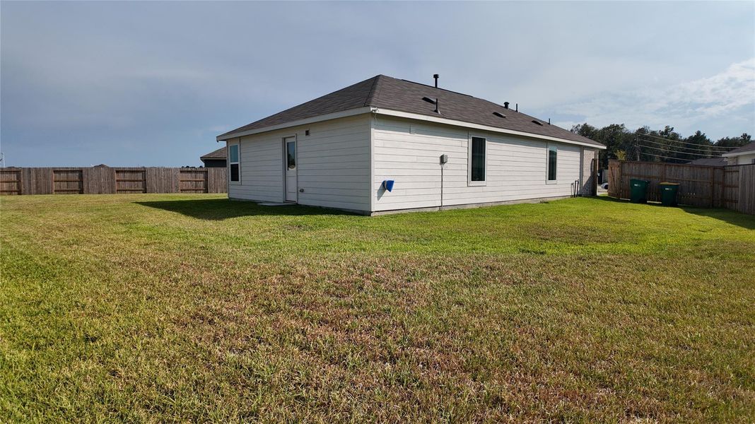 The backyard offers privacy with no neighbors behind the house. Perfect for enjoying peaceful afternoons. The backyard offers privacy with no neighbors behind the house. Perfect for enjoying peaceful afternoons.